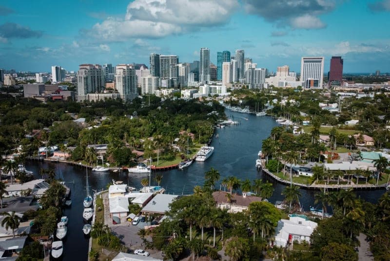 Yachts moored along the Fort Lauderdale canals with the downtown skyline behind