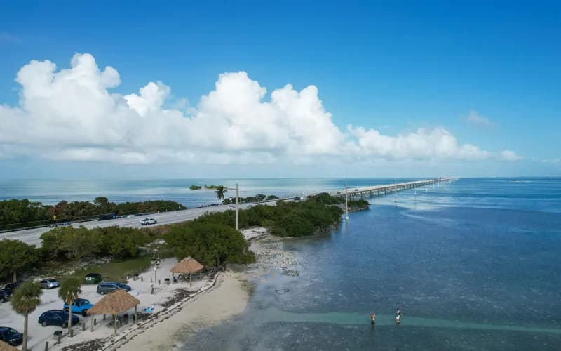 Aerial view of a bridge linking two islands in the Florida Keys over shallow blue water